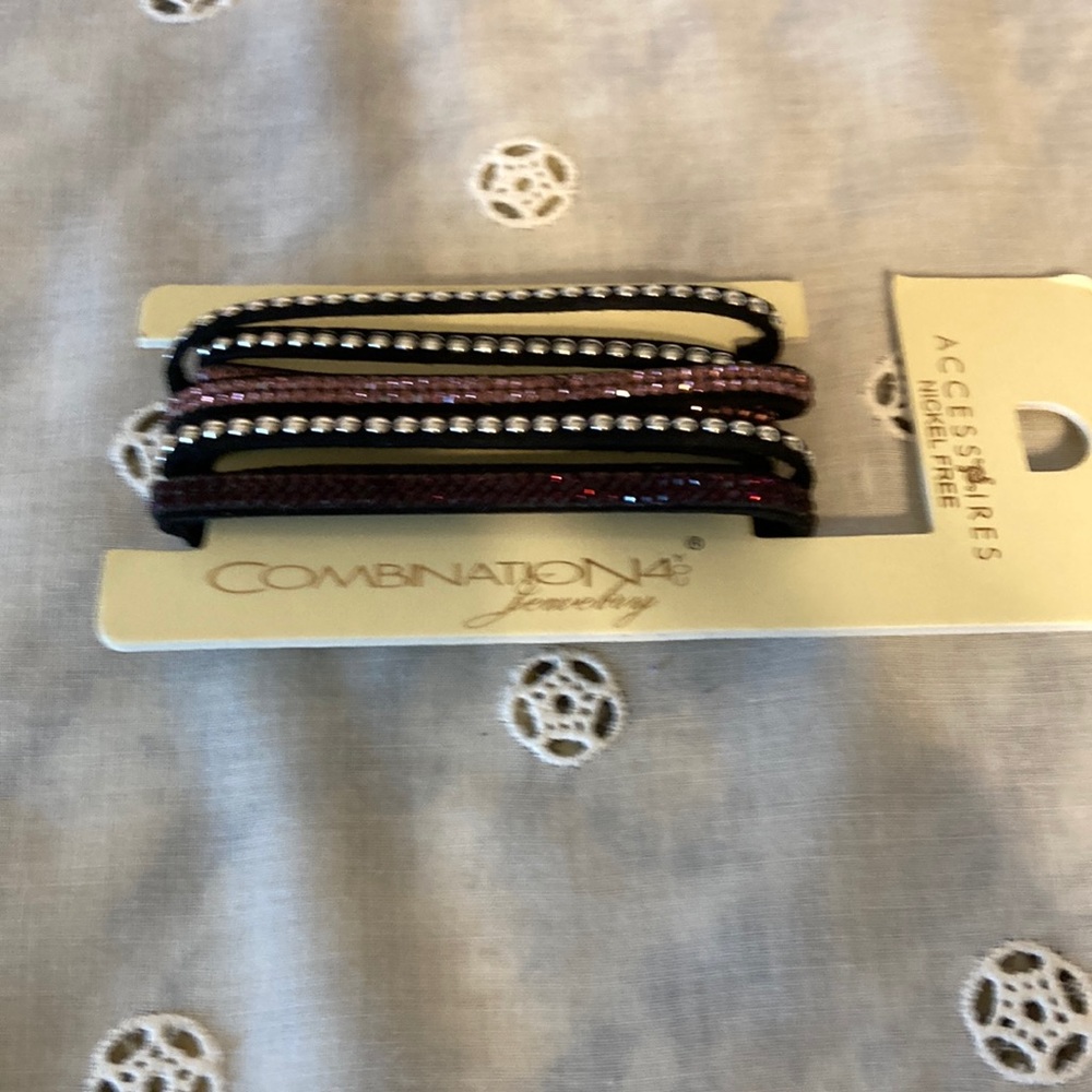 Wrap around bracelet NWT with studs. Black and purple